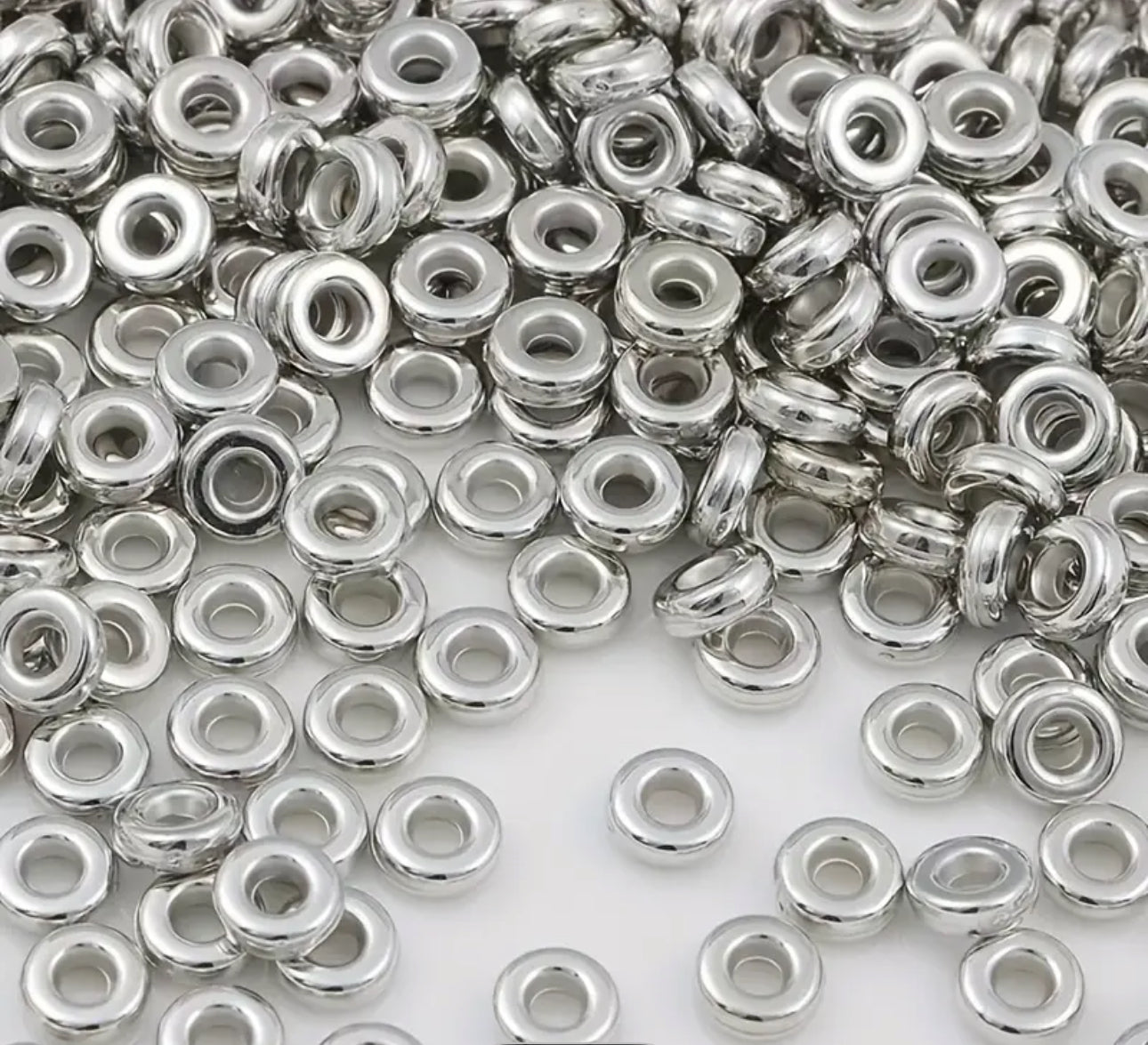 Perles intercalaires plates rondes lisses – 6 mm