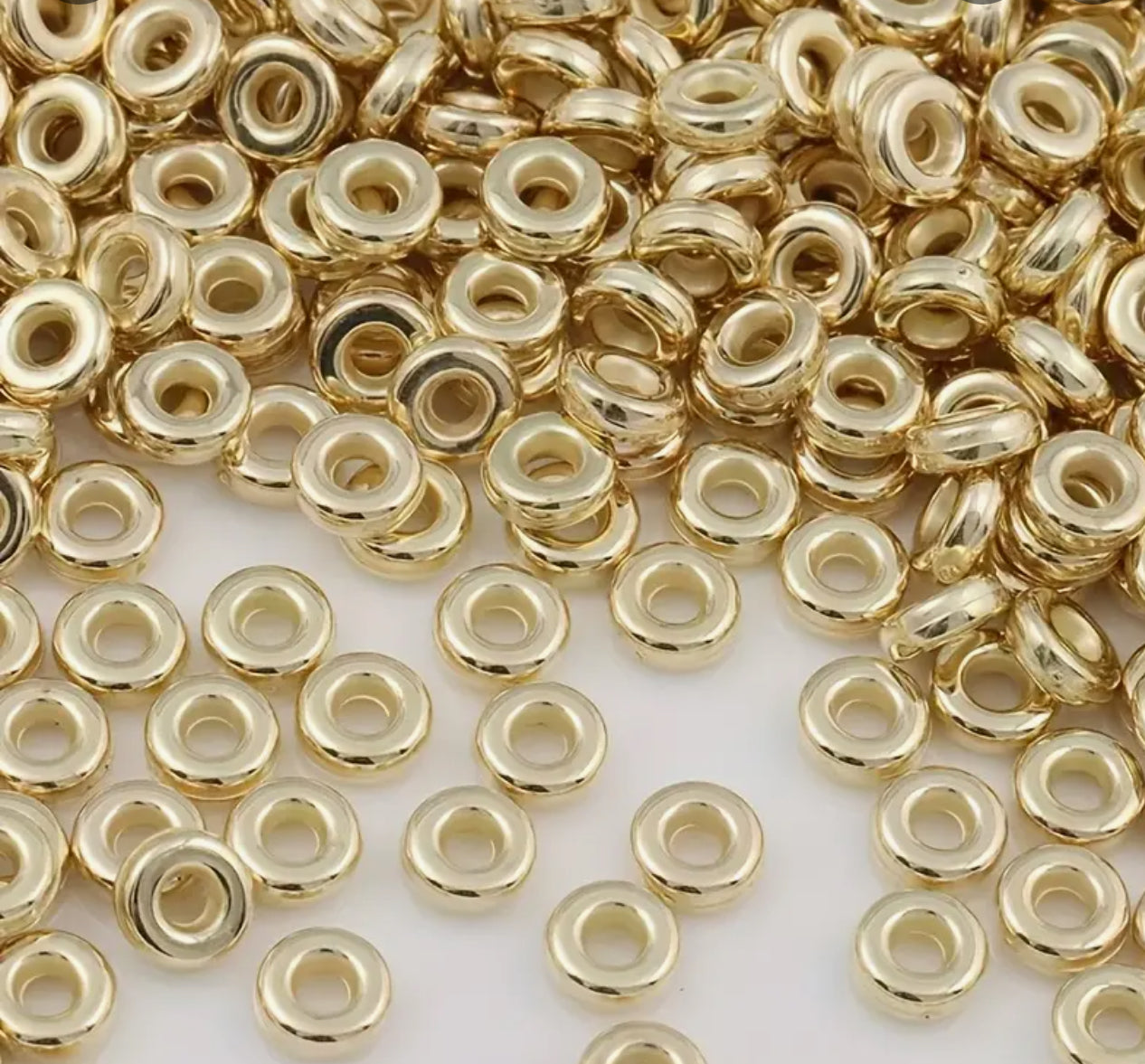 Perles intercalaires plates rondes lisses – 6 mm